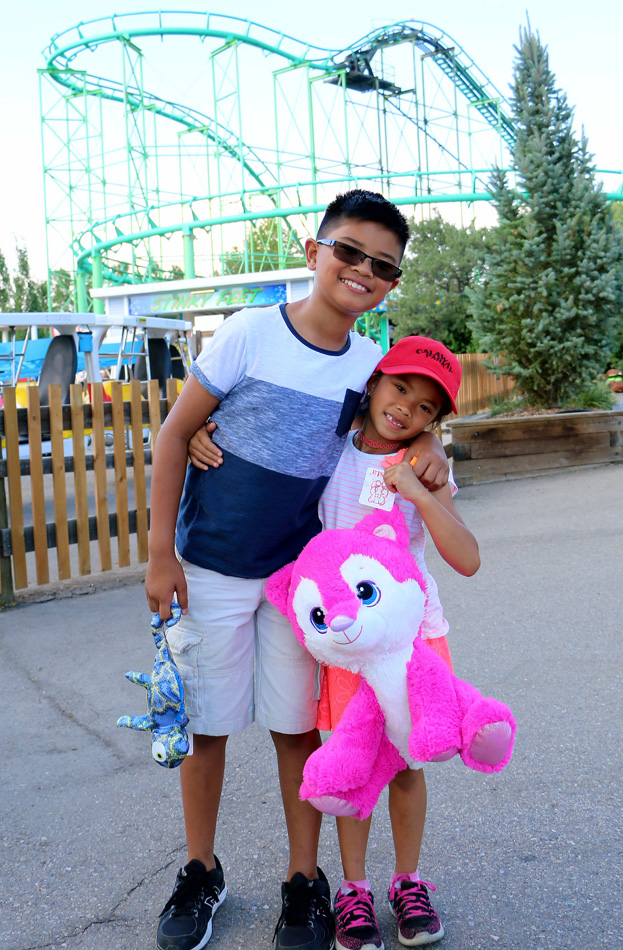 catered Siblings in front of rollercoaster